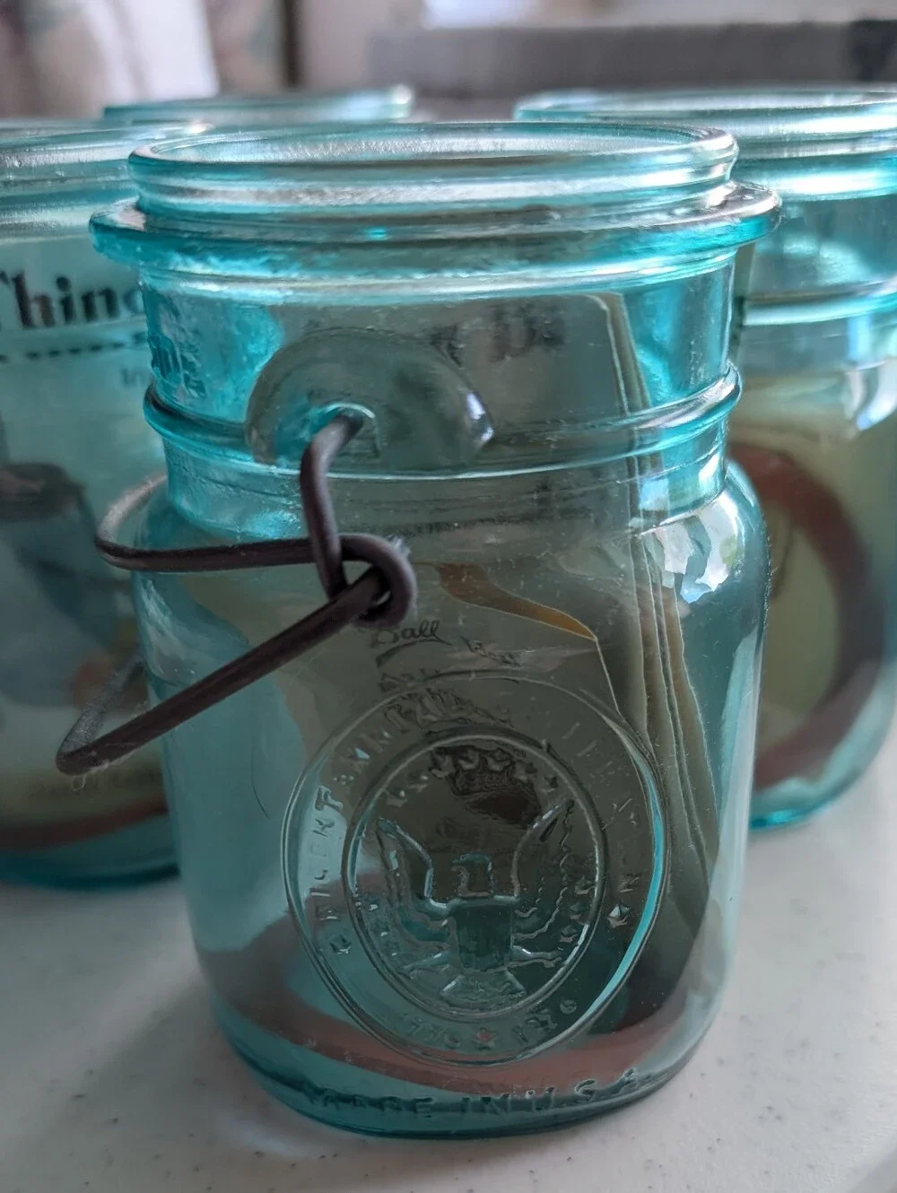 Set Of 4 Blue Ball Ideal Glass Mason Jars with Wire Bail Lids Farmhouse Decor